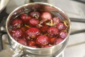 red pearl onions on the stove