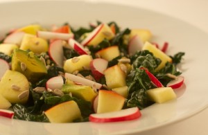 kale salad with honey-ginger-lemon dressing, radishes, apples, and avocado